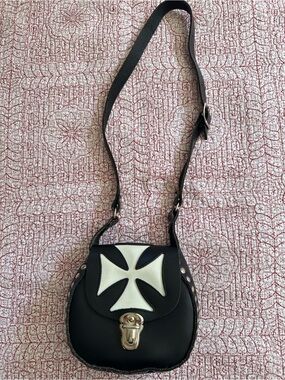 Like new Genuine Black Leather Crossbody Bag with White Cross Accent.